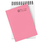 Pink notebook with 'Melissa LeBlanc' branding on a white background