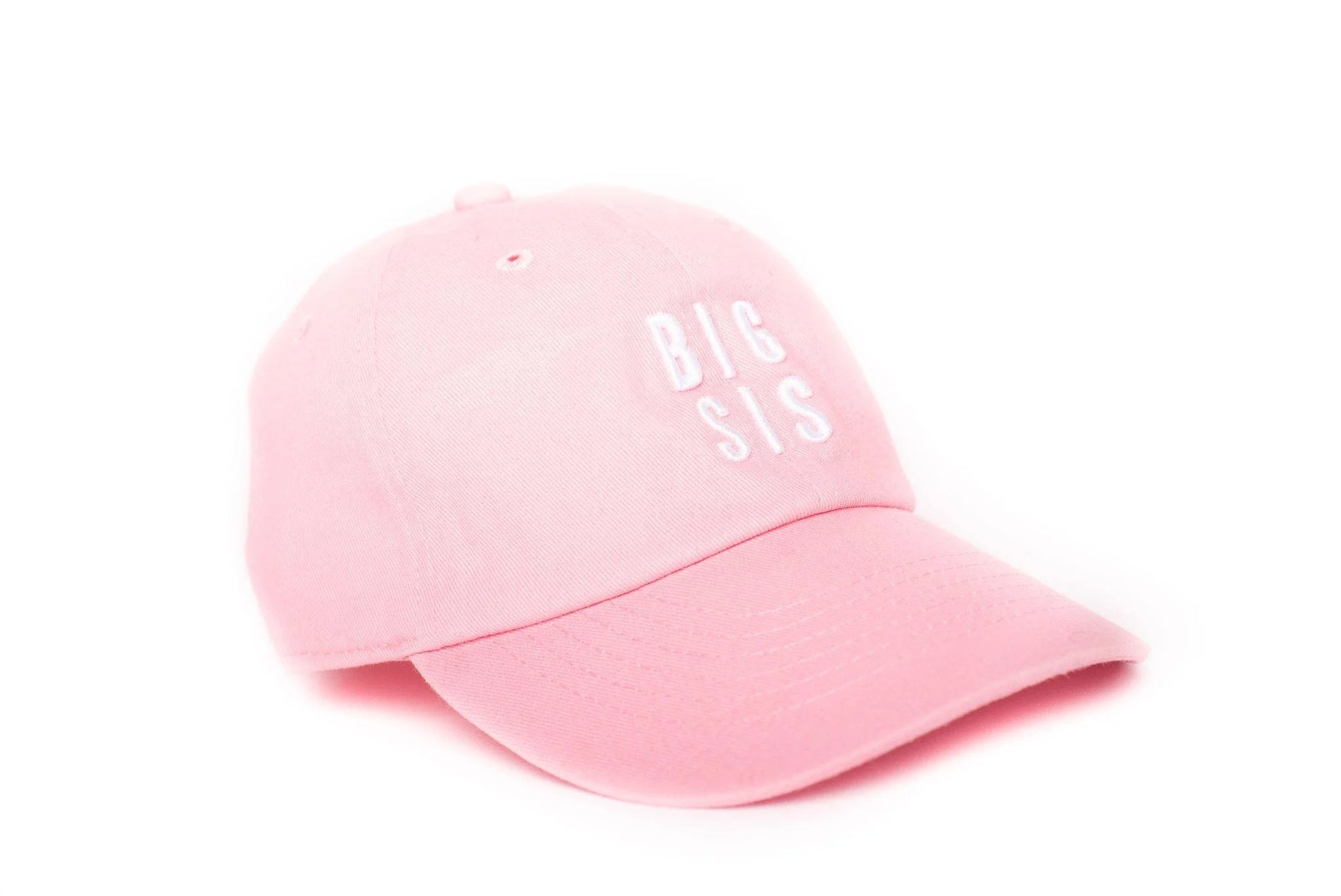 Pink cap with 'BIG SIS' text on a white background