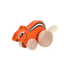 Wooden toy squirrel on a white background