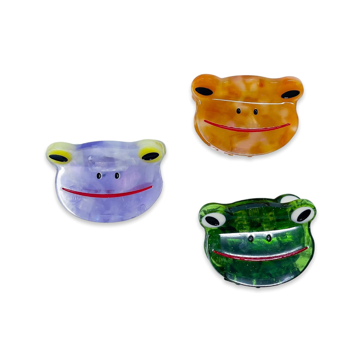 Three colorful frog-shaped objects on a white background