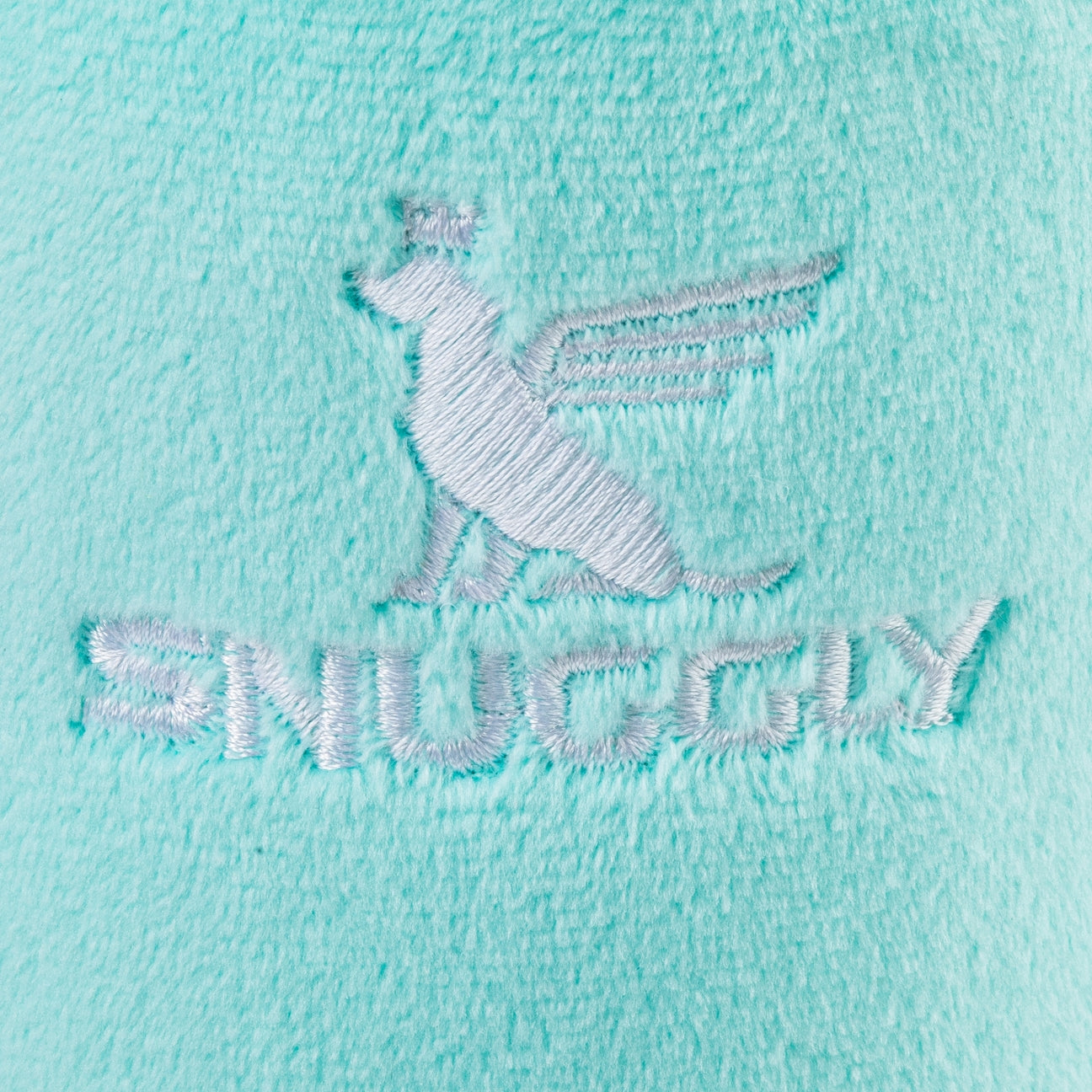 Close-up of a logo on a light blue fabric with 'Snuggly' text.