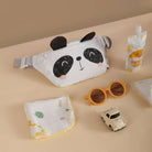 Panda-themed pouch, sunglasses, and small car toy on a beige surface