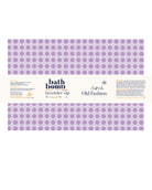 A rectangular package of bath bomb labeled 'lavender sip' with a lavender purple polka dot pattern on a white background. Visible text includes 'bath bomb', 'lavender sip', 'Craft by Old Fashion', and 'The Artisan Bar'.