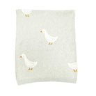 Light gray knit sweater with white duck designs on a white background
