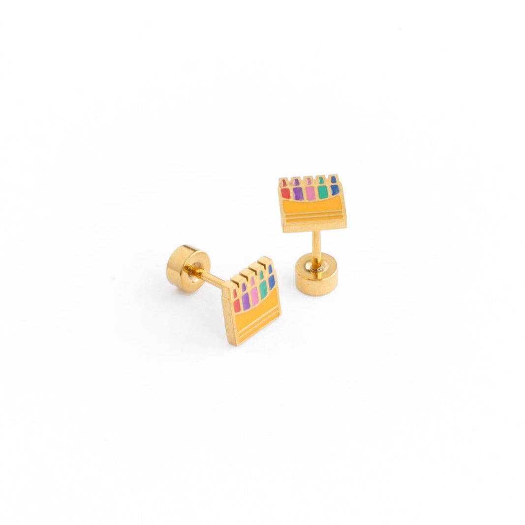 Gold earrings with colorful accents on a white background