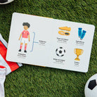 Children's book about soccer on grass with soccer ball and jersey