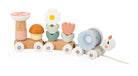 Wooden toy train with colorful wheels and floral design on a white background