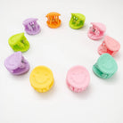 Colorful hair clips arranged in a circular pattern on a white background