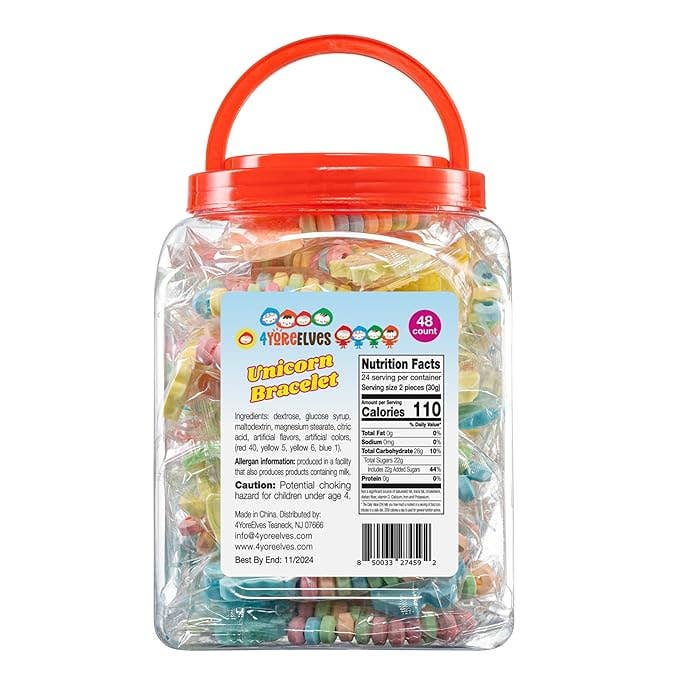 A clear plastic tub filled with assorted colorful gummy candies, featuring a bright red handle lid and a front label for 'Yerba Elves Unicorn Bracelet'.