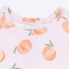Baby onesie with peach pattern on a white background