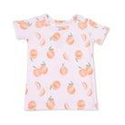 White t-shirt with peach pattern on a white background