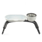 Pet feeding station with two bowls on a white background