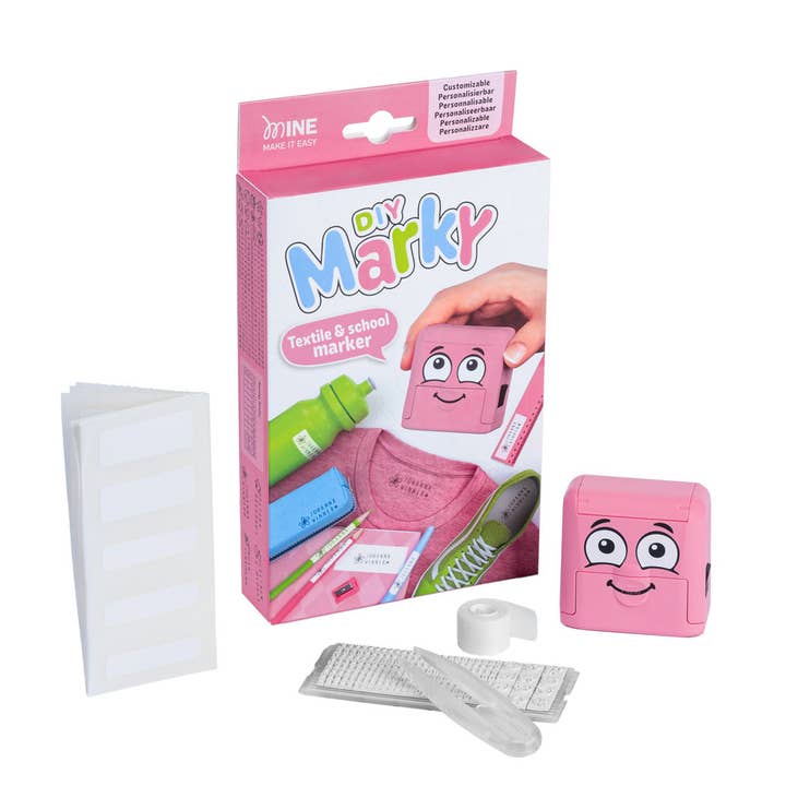 Pink 'On Marky' textile and school marker packaging with a cartoon character on a white background