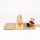 Wooden toy with a dog figure and a pyramid-shaped stand on a white background