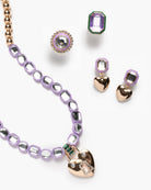 Jewelry set with heart-shaped pendants on a white background