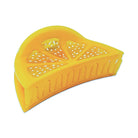Yellow plastic lemon squeezer on a white background