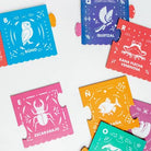 Colorful puzzle pieces with animal illustrations and Spanish text on a white background