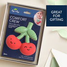 Baby teether with packaging labeled 'Comfort Crew' by itzy ritzy, on a light background.