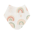 A white muslin baby bib featuring a repeating pattern of pastel rainbow arches in peach, green, and orange, shown on a solid white background.