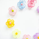 Colorful flower-shaped candies on a white background
