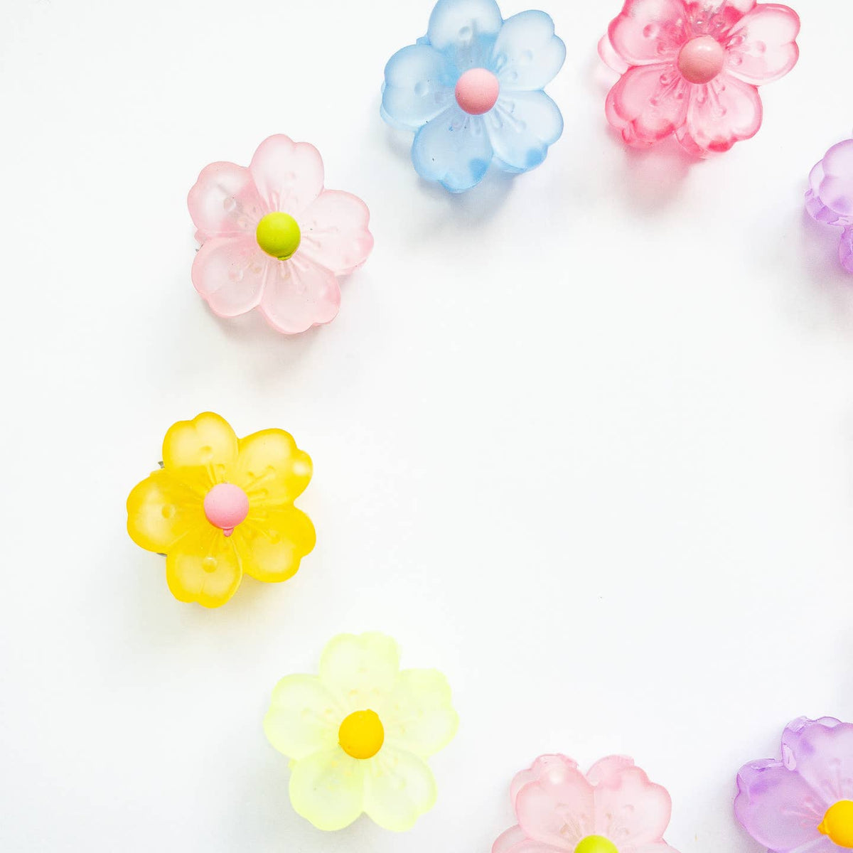 Colorful flower-shaped candies on a white background