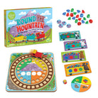 Board game set 'Round the Mountain' with colorful train pieces and packaging.