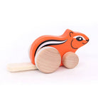 Wooden toy squirrel on a white background