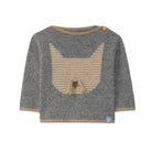 Gray sweater with a bear design on a light gray background