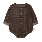 A long-sleeve baby romper in brown with a beige windowpane plaid pattern, featuring a button-up front and cuffed sleeves, shown on a plain white background.