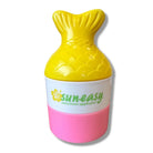 Sun-easy sunscreen applicator with yellow top and pink bottom on a white background
