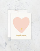 Greeting card with a pink heart and 'Congrats, mama' text on a white background