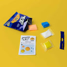 Air Dry Clay kit with packaging, clay pieces, and instructions on a yellow background