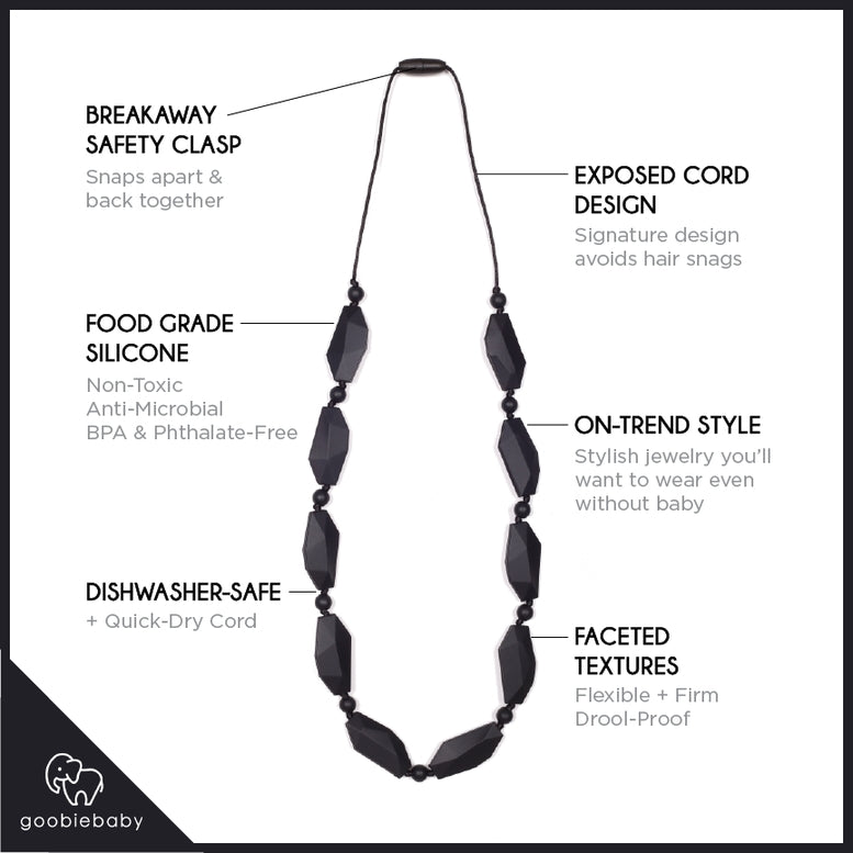 A black beaded necklace with features, elongated faceted beads and small spacer beads on a thin cord, shown against a plain white background.