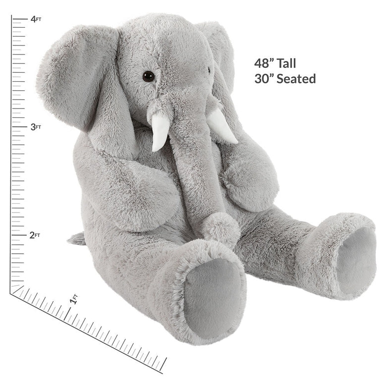 Gray plush elephant toy with measurements on a white background