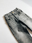 Pair of gray jeans on a white background
