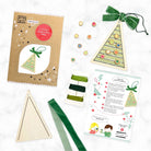 Craft kit components including a cardboard tree template, ribbons, and instructions on a white background