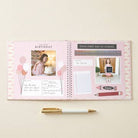 Open planner with photos and text on a light beige background
