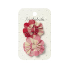 Two checkered hair bows on a Rockahula branded card against a white background