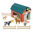 Wooden Big Red Barn Playset by Mentari set against a clean white background, showcasing the complete set including the two-story red and green barn, opening double doors, a working pulley system with a yellow magnetic hay bale, wooden fence sections, a blue ladder, and small wooden animal figures including a cow, horse, pig, sheep, goat, chicken, and rooster.