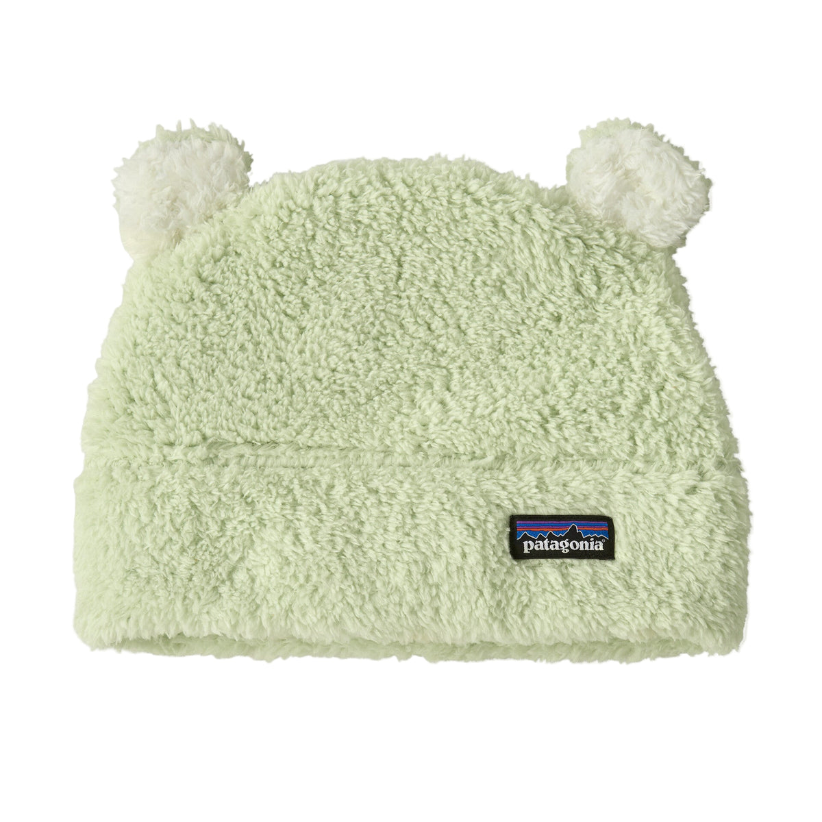 A light mint green Patagonia fleece beanie with two fluffy pom-poms on top and a black Patagonia logo patch on the front cuff, shown against a plain white background.