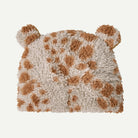 Fluffy pillow with brown and beige pattern on a white background