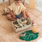 Child playing with toys on a carpeted floor