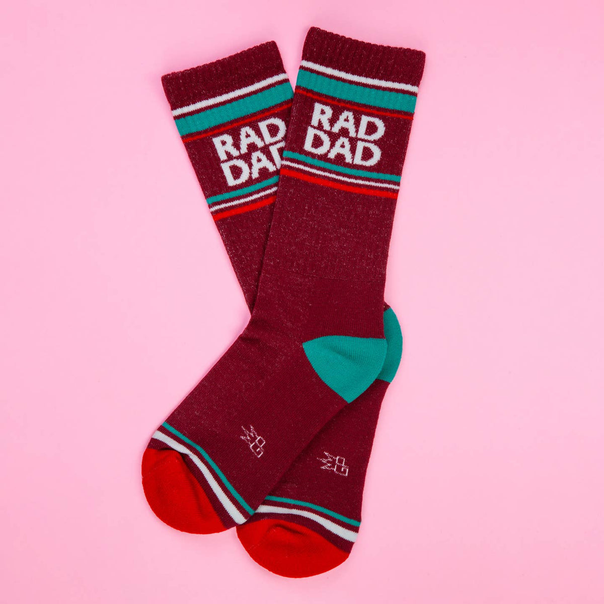Maroon socks with 'RAD DAD' text on a pink background