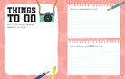 Page from a travel journal with prompts for holiday planning on a pink background.