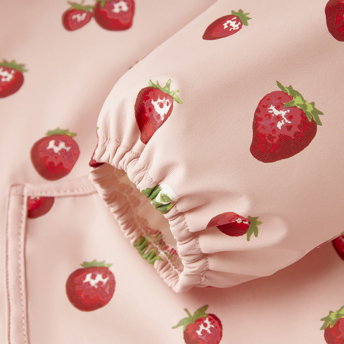 Pink fabric with strawberry pattern