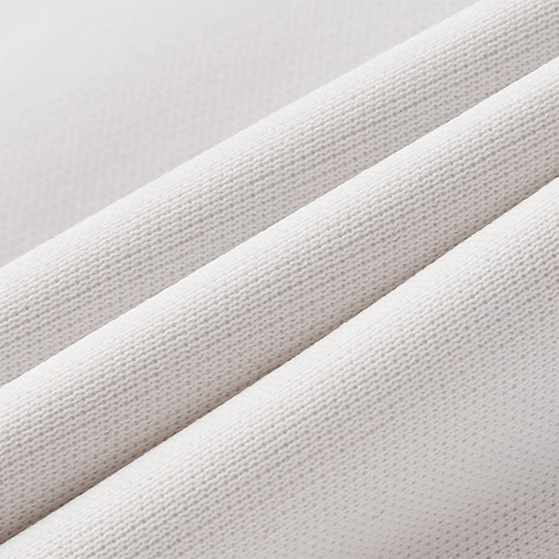 Close-up of textured beige fabric with a subtle pattern