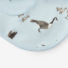 Bib with goose pattern on a light blue background