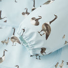 Baby bloomers with goose pattern on a light blue background