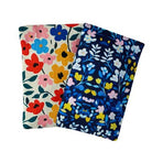 Two floral-patterned pouches on a white background