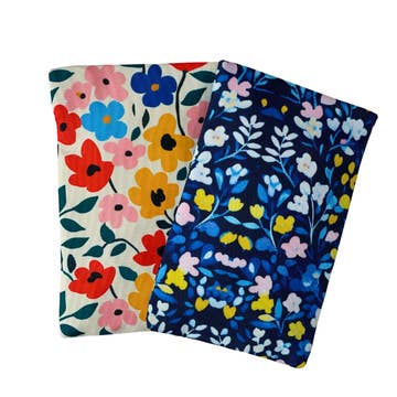 Two floral-patterned pouches on a white background